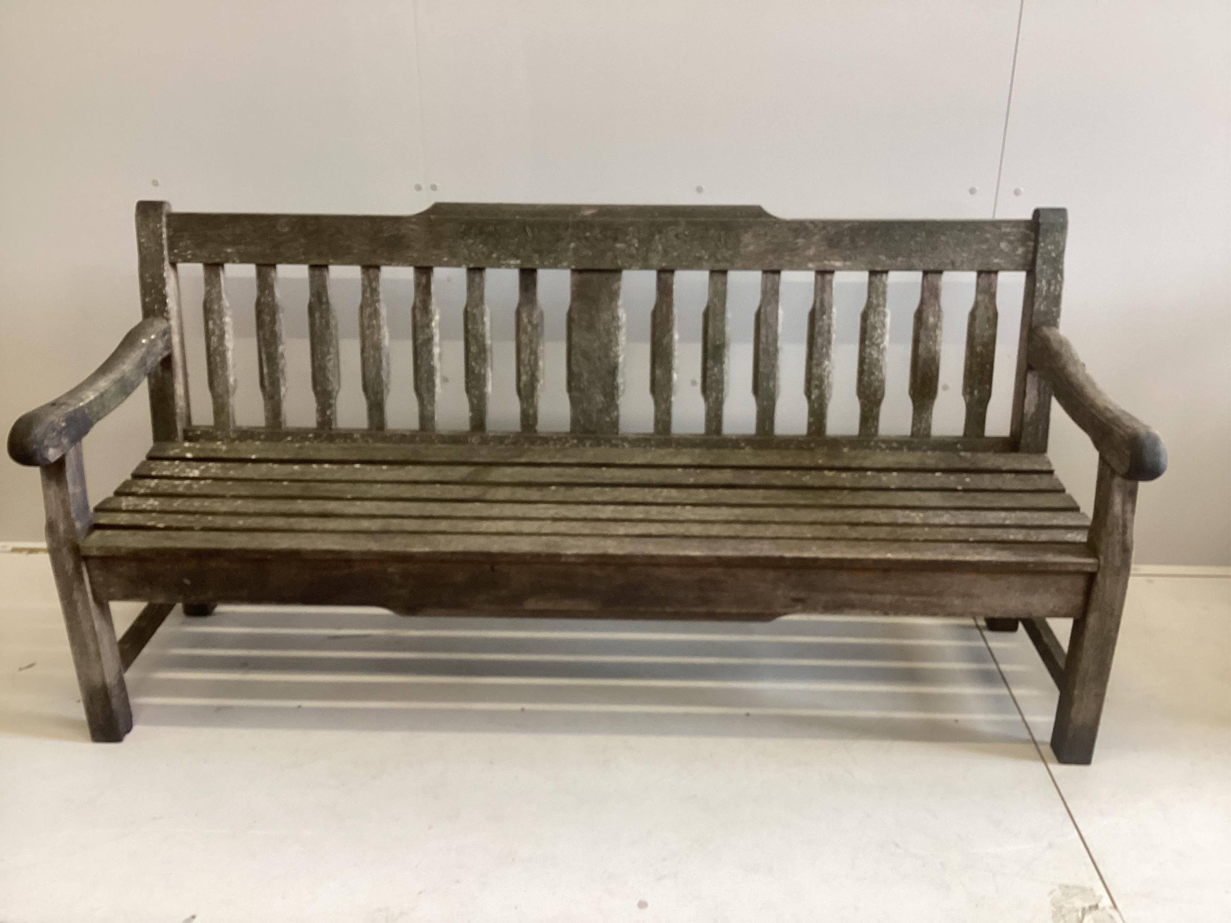 A vintage Bridgman & Co iroko hardwood garden bench, width 184cm, depth 51cm, height 90cm. Condition - fair